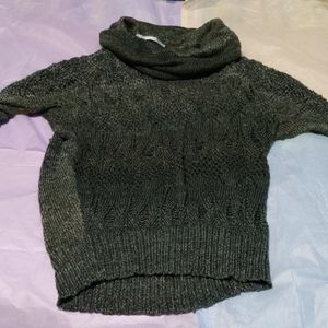 Maurice's turtle neck sweater.